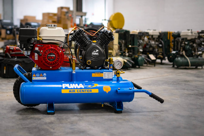 Blue Puma air compressor in a warehouse setting